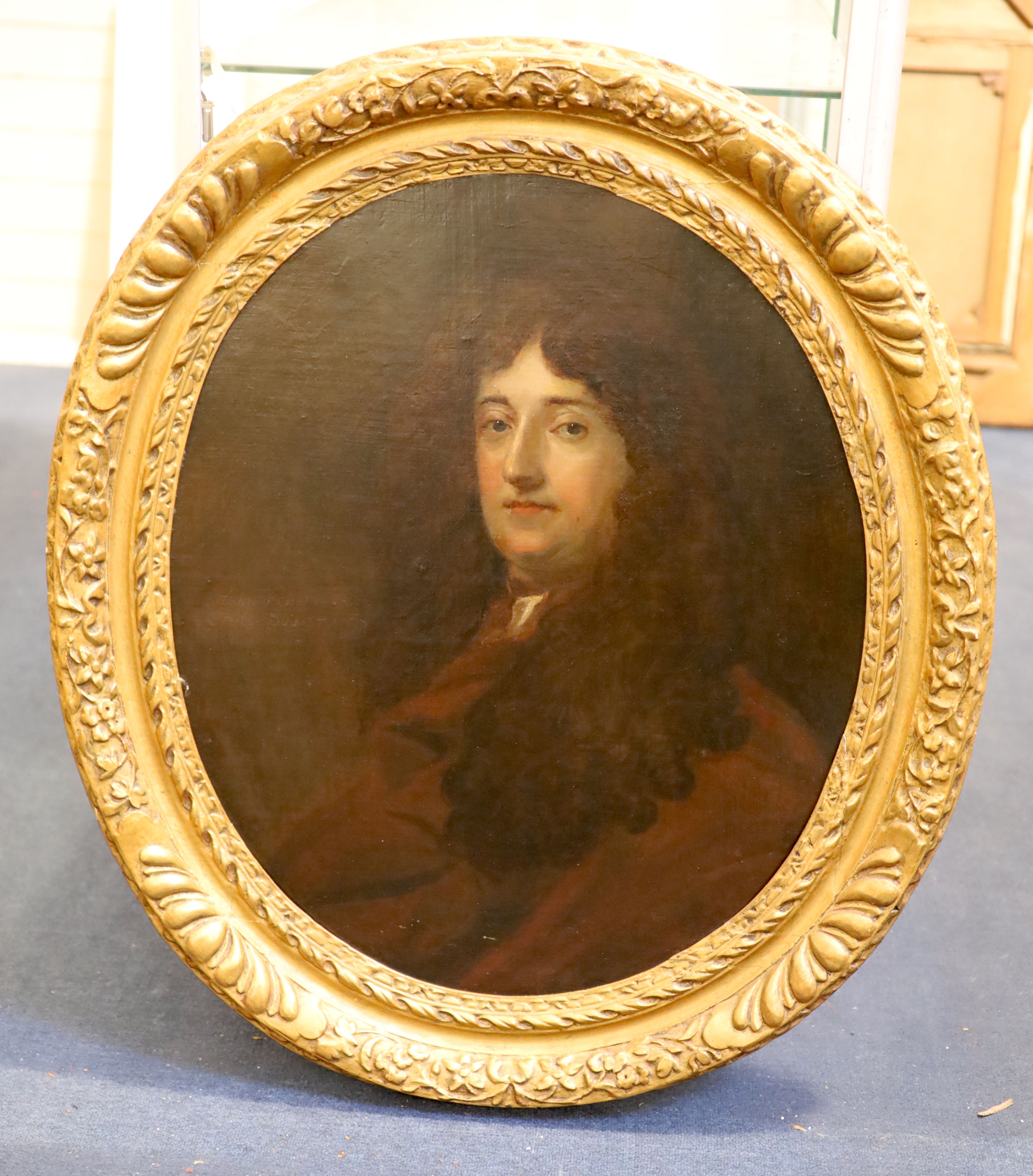 Circle of Sir Peter Lely (1618-1680) Portrait of a gentleman wearing a brown coat oval, 29 x 24in.